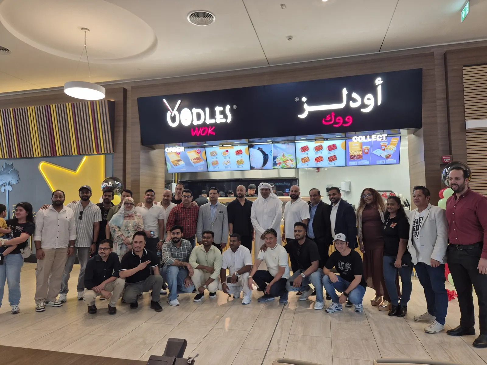 The Oodles Wok team and partners outside the new store at Doha Festival City on opening day