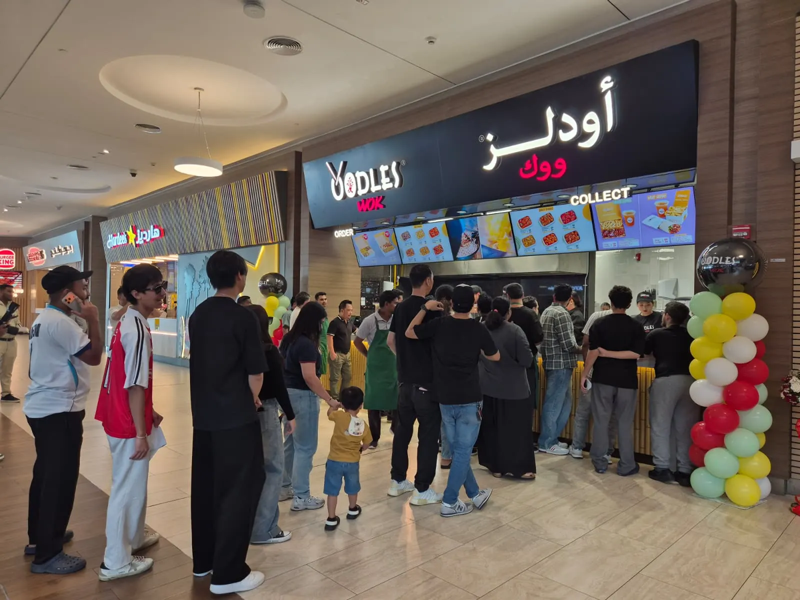 Guests queueing at the Oodles Wok counter at Doha Festival City on day one